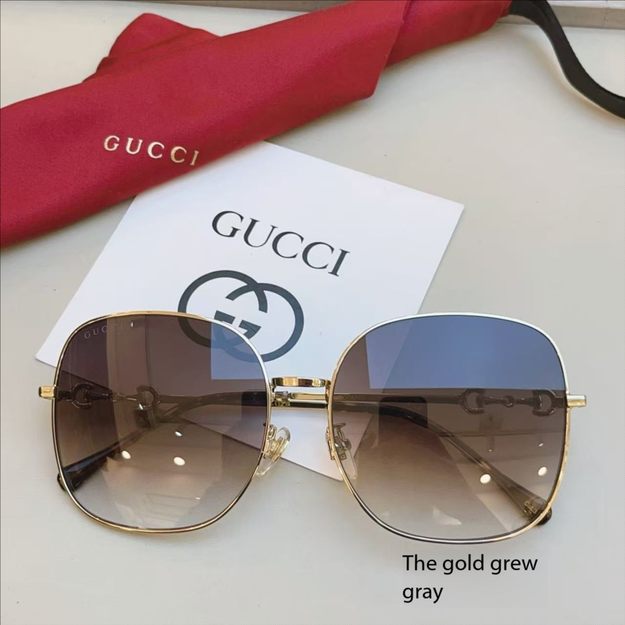 GUCCI 26S OVERSIZED HEXAGON IN GOLD GREW GRAY METAL
