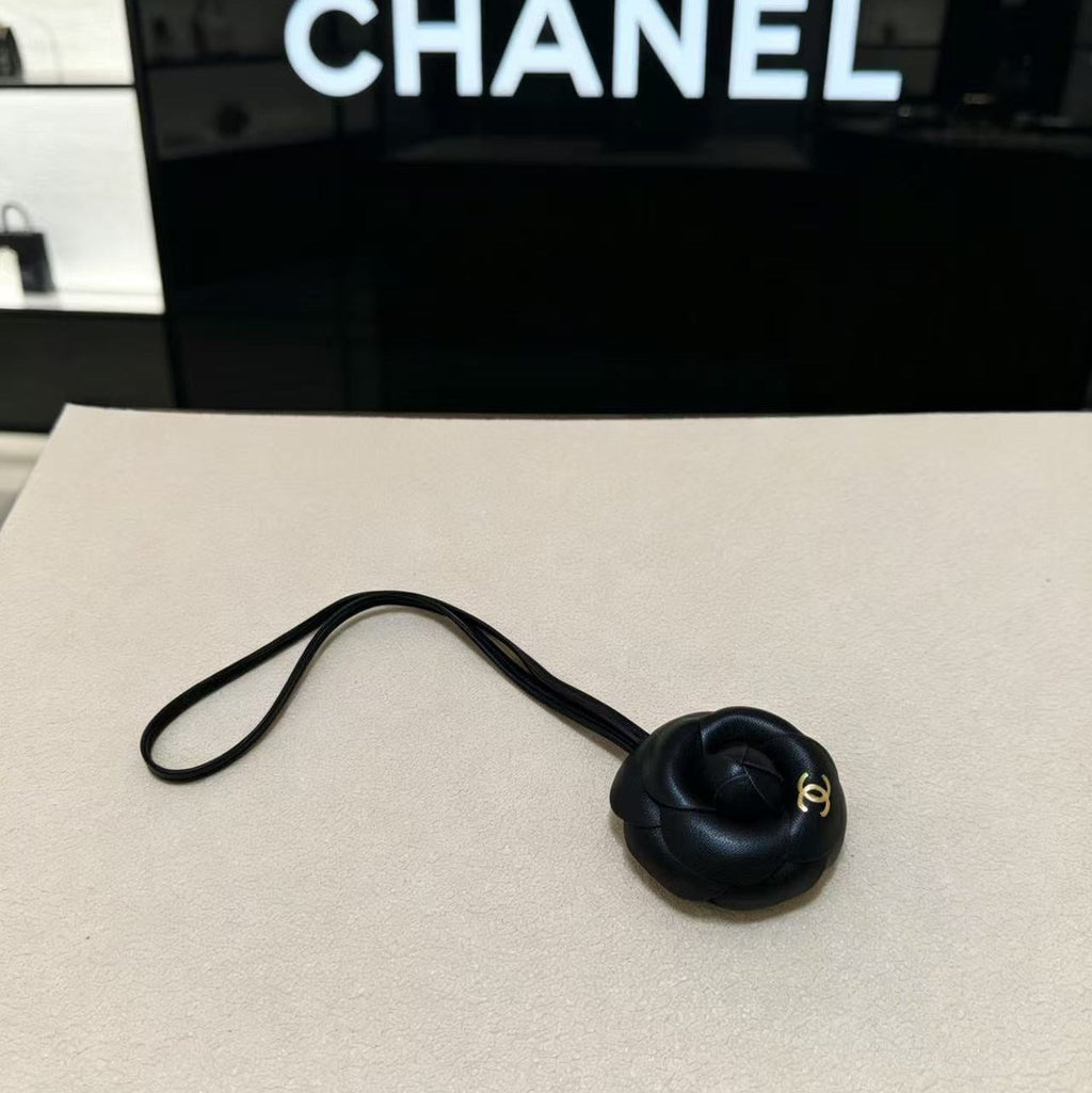CHANEL CAMELLIA BAG CHARM IN BLACK LAMBSKIN