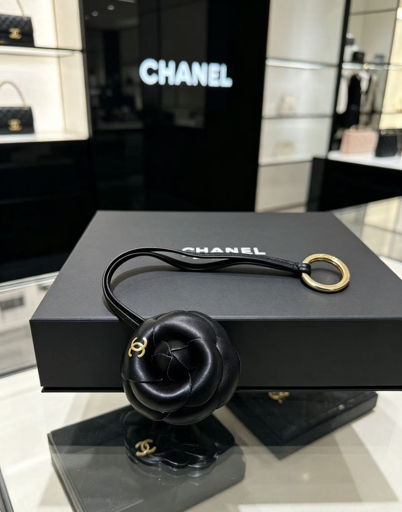 CHANEL CAMELLIA BAG CHARM IN BLACK LAMBSKIN
