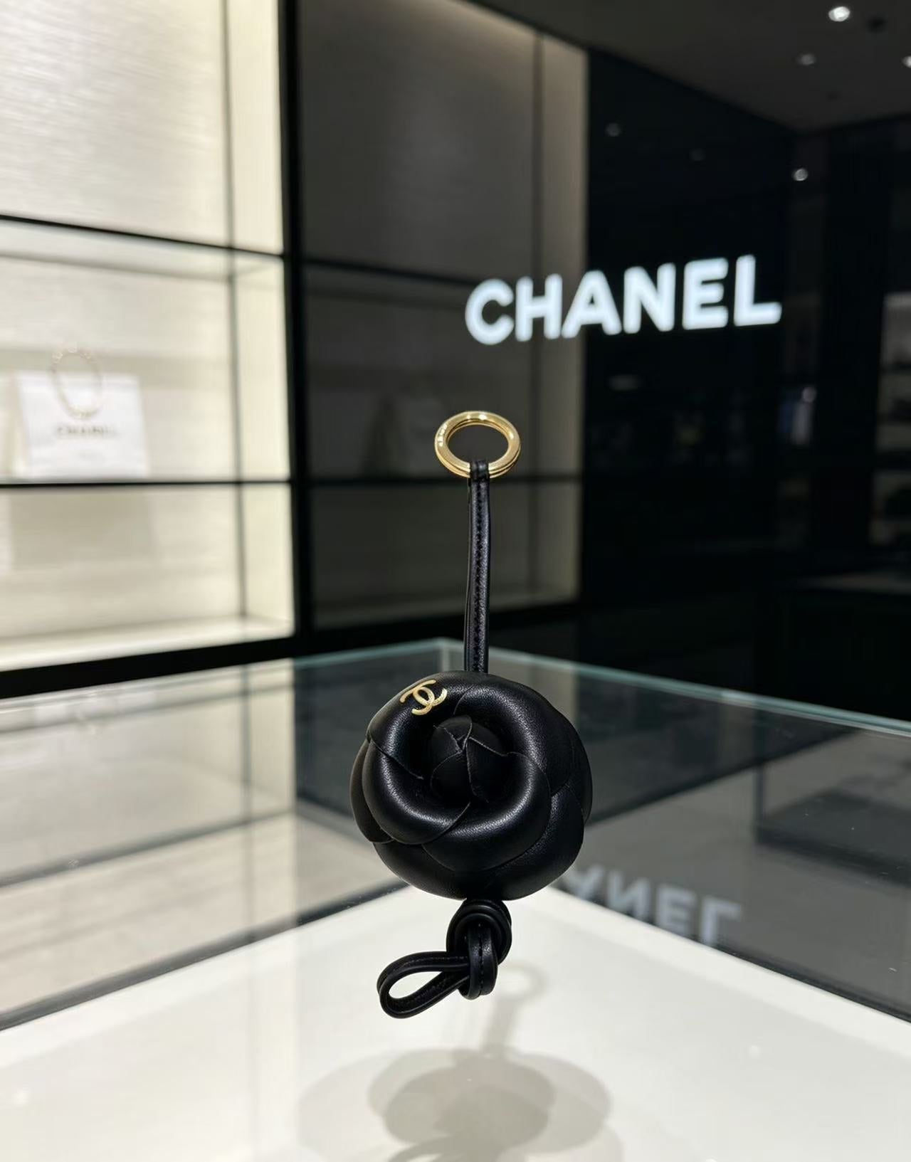 CHANEL CAMELLIA BAG CHARM IN BLACK LAMBSKIN