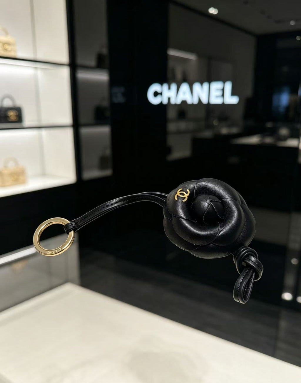 CHANEL CAMELLIA BAG CHARM IN BLACK LAMBSKIN