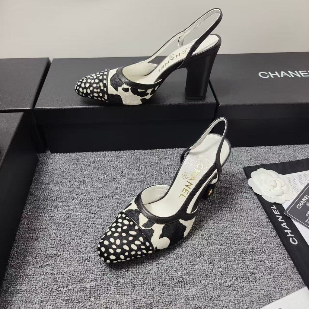 CHANEL SLINGBACK HEELS IN BLACK AND WHITE COW PRINT
