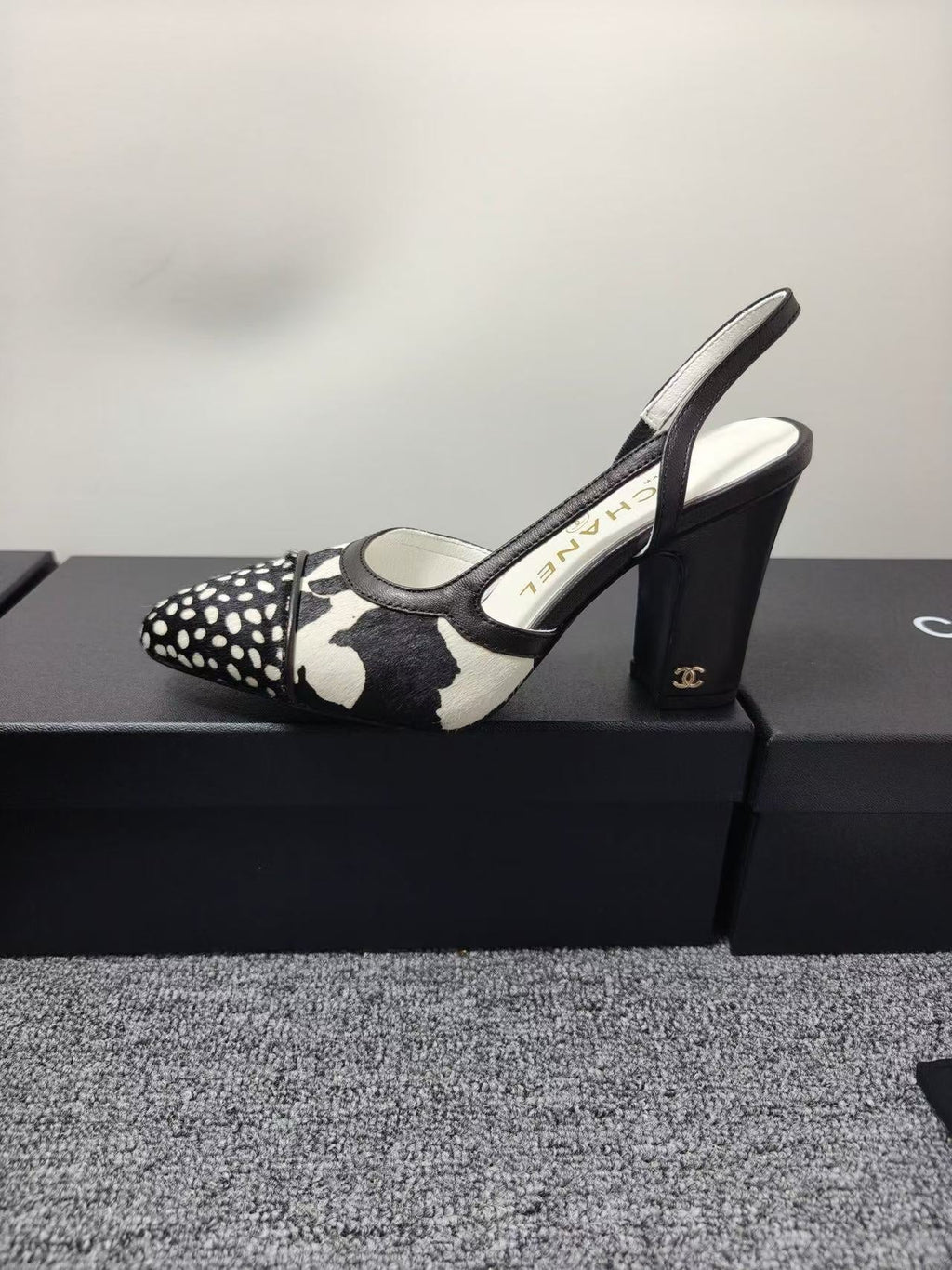 CHANEL SLINGBACK HEELS IN BLACK AND WHITE COW PRINT