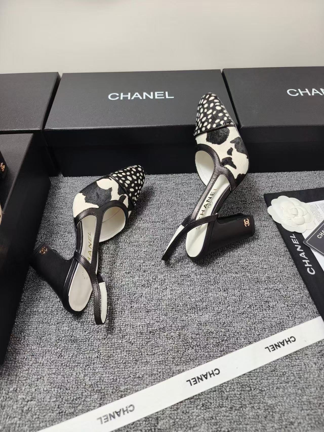 CHANEL SLINGBACK HEELS IN BLACK AND WHITE COW PRINT