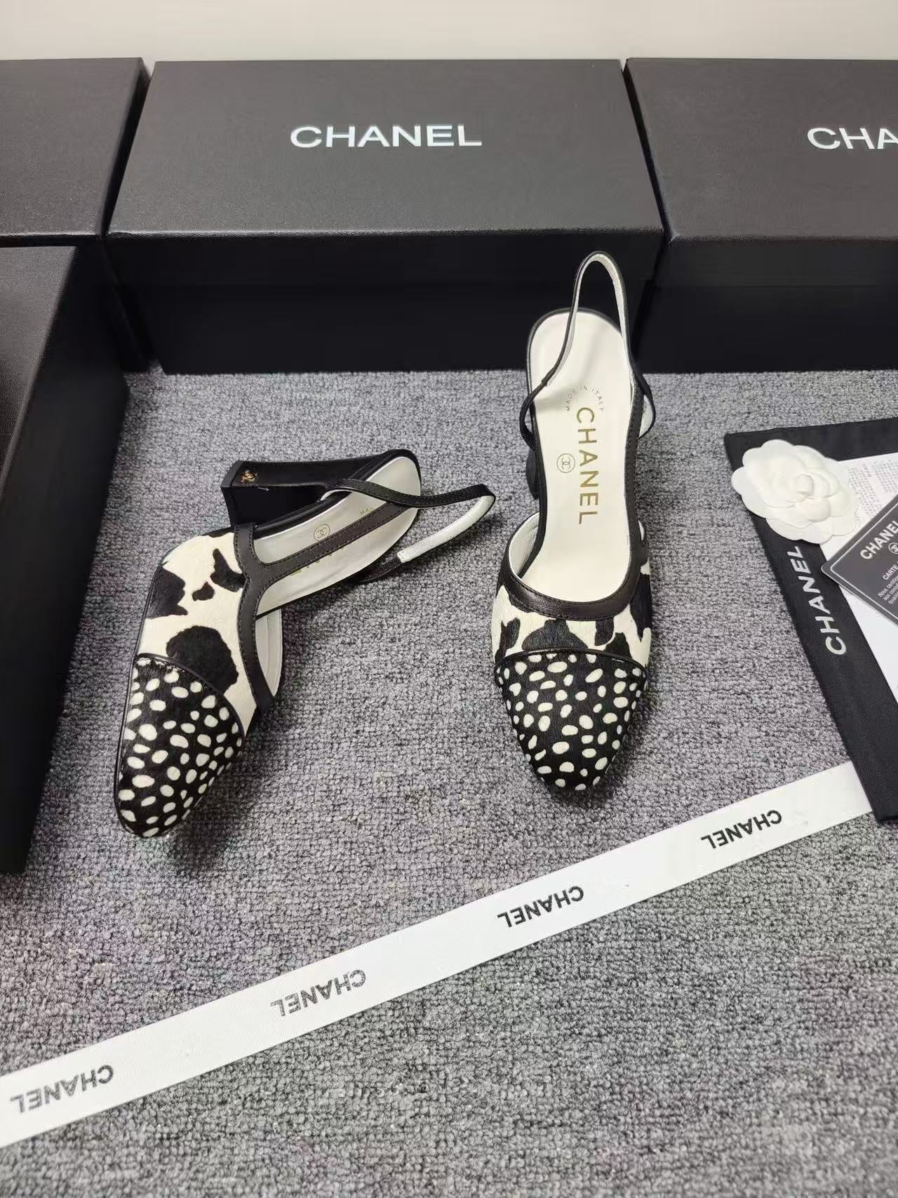 CHANEL SLINGBACK HEELS IN BLACK AND WHITE COW PRINT