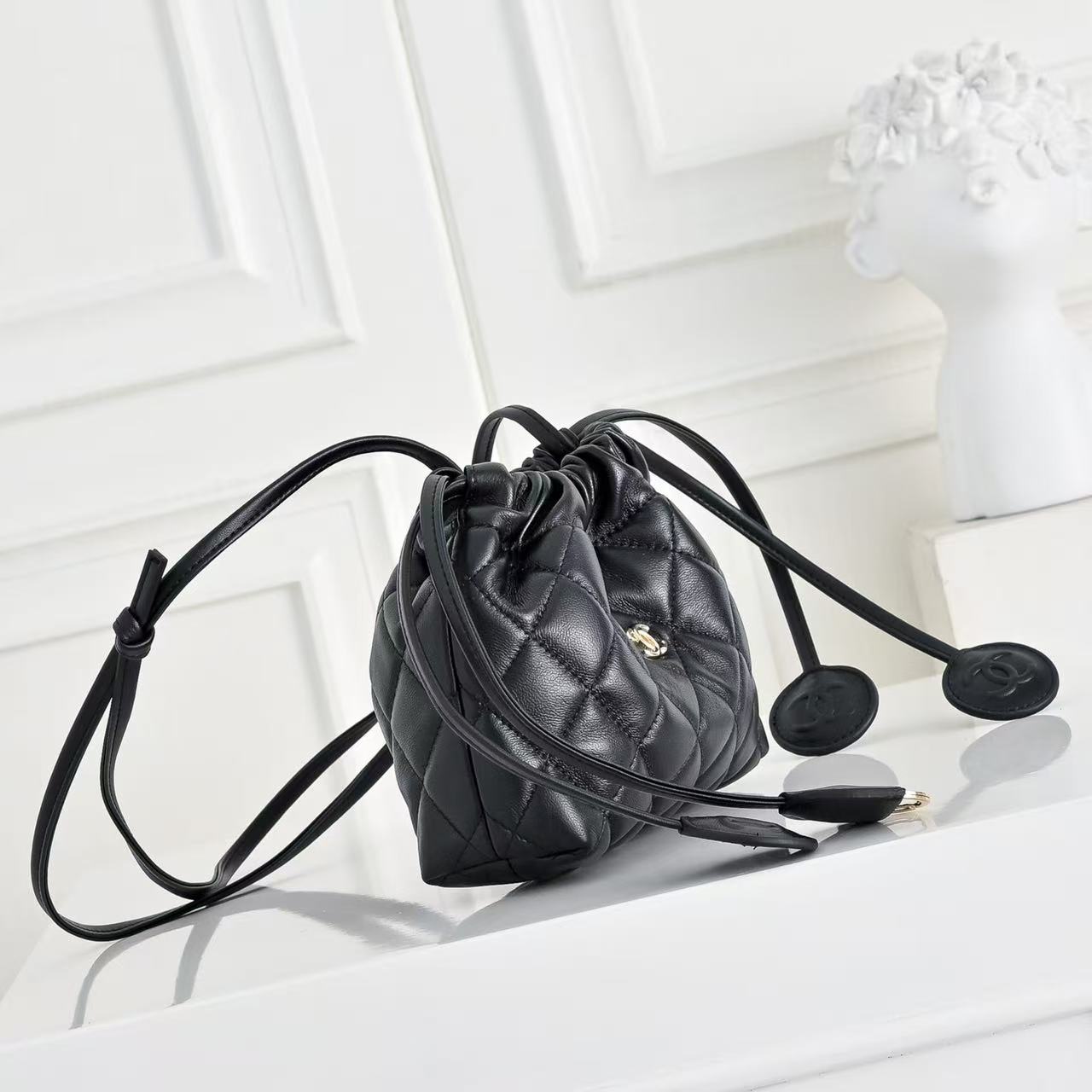 CHANEL 26S DRAWSTRING BUCKET BAG IN BLACK CALFSKIN