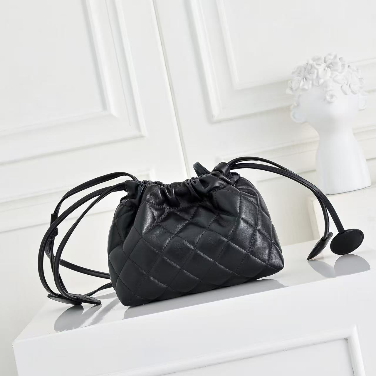 CHANEL 26S DRAWSTRING BUCKET BAG IN BLACK CALFSKIN