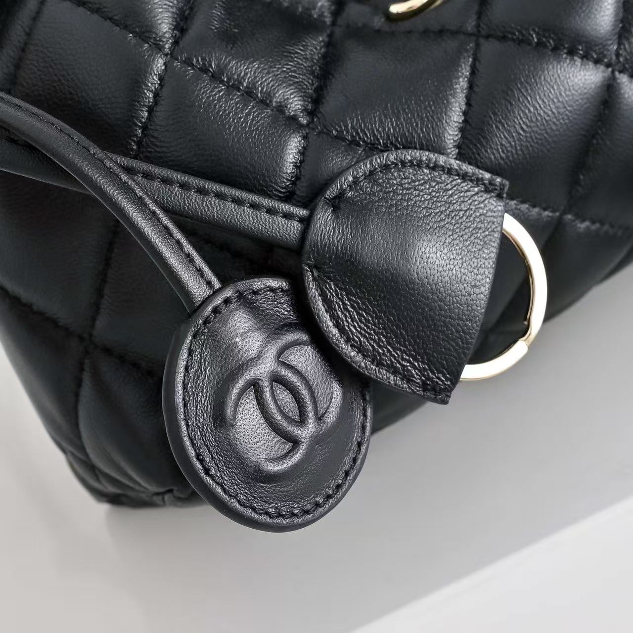 CHANEL 26S DRAWSTRING BUCKET BAG IN BLACK CALFSKIN