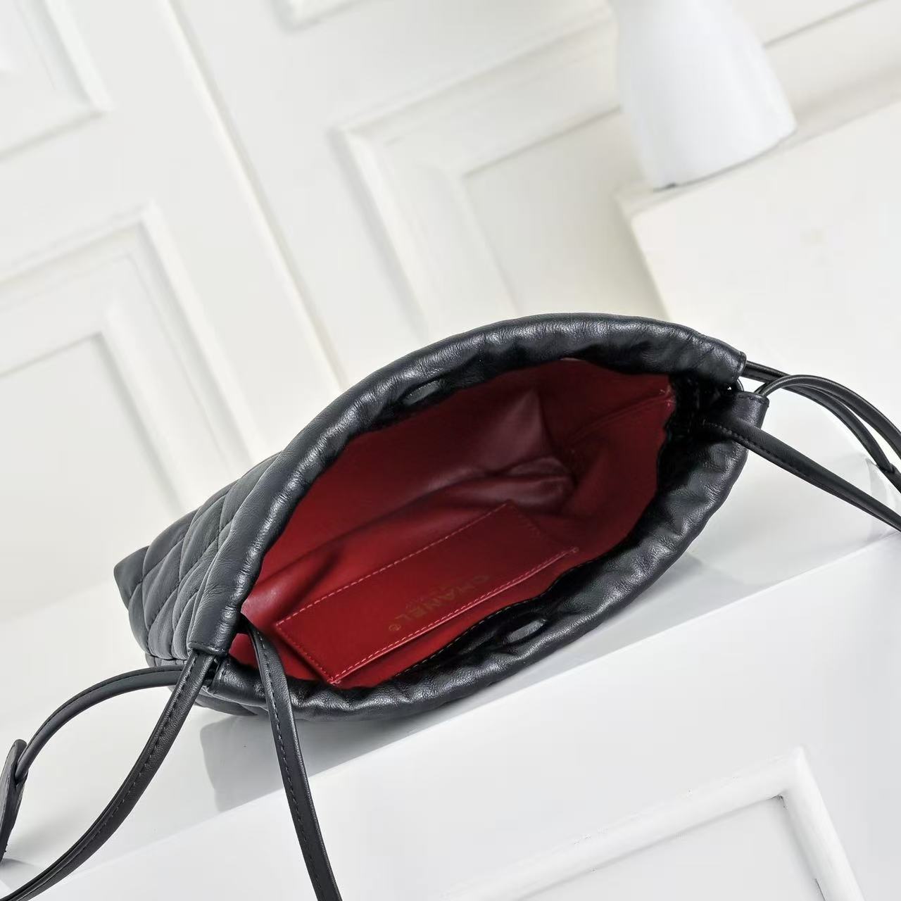 CHANEL 26S DRAWSTRING BUCKET BAG IN BLACK CALFSKIN