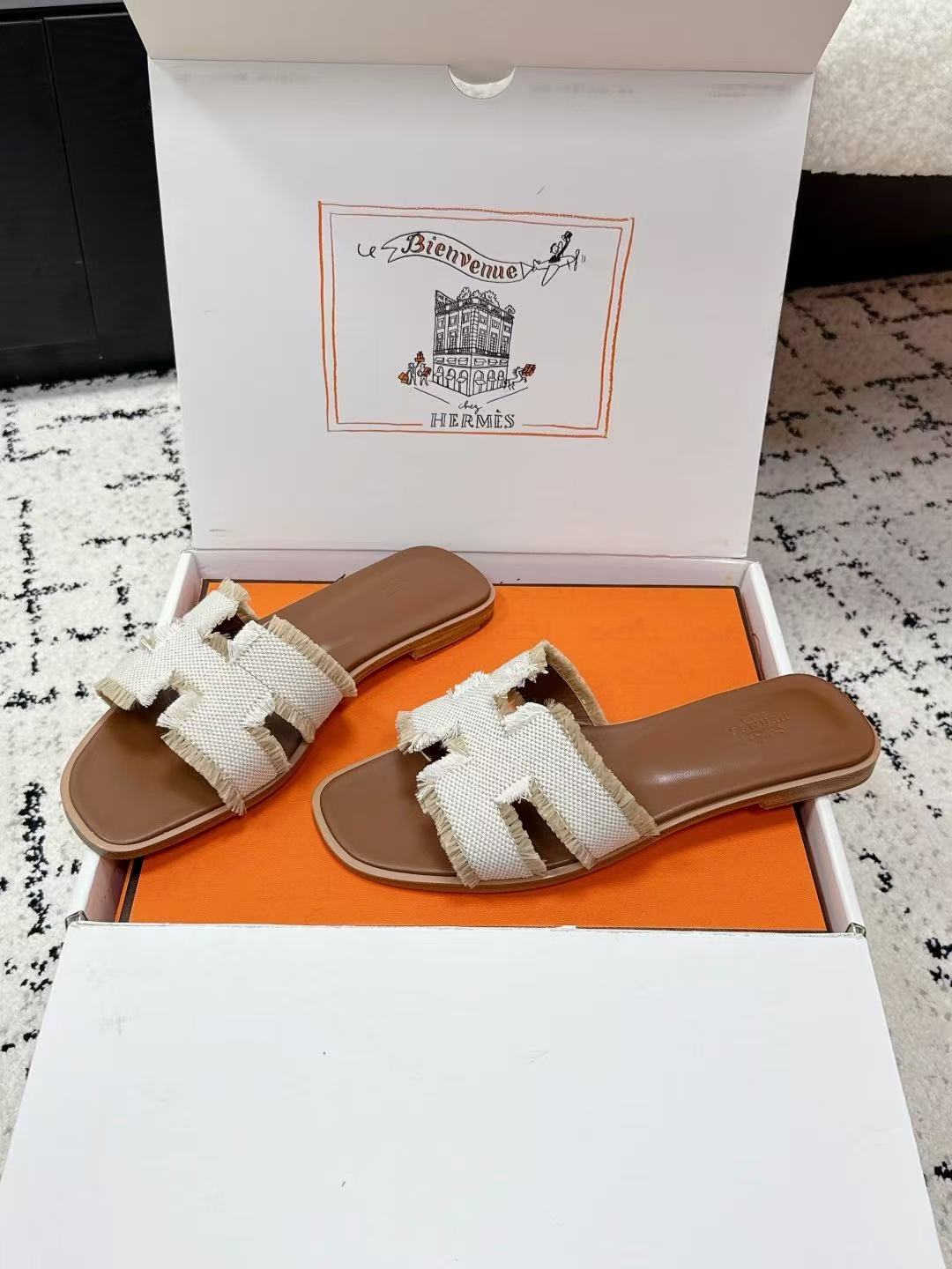 HERMES 26S ORAN FRINGED SLIDE SANDALS IN ECRU CANVAS