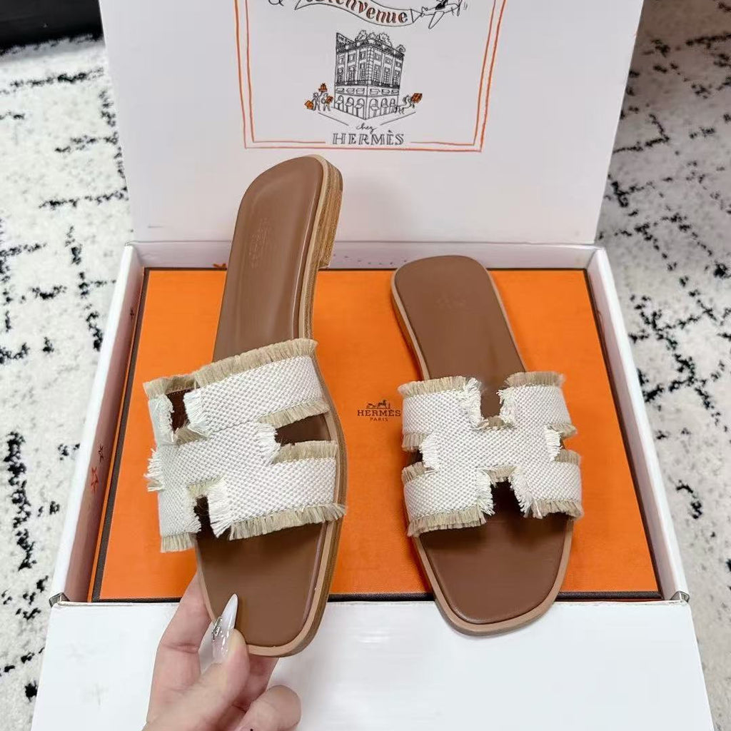 HERMES 26S ORAN FRINGED SLIDE SANDALS IN ECRU CANVAS