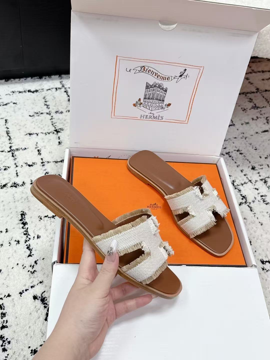 HERMES 26S ORAN FRINGED SLIDE SANDALS IN ECRU CANVAS