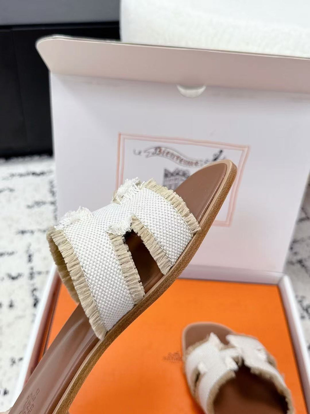 HERMES 26S ORAN FRINGED SLIDE SANDALS IN ECRU CANVAS
