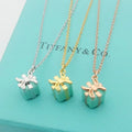 TIFFANY 26s GIFT BOX PENDANT NECKLACE IN BLUE ENAMEL AND GOLD PLATED METAL