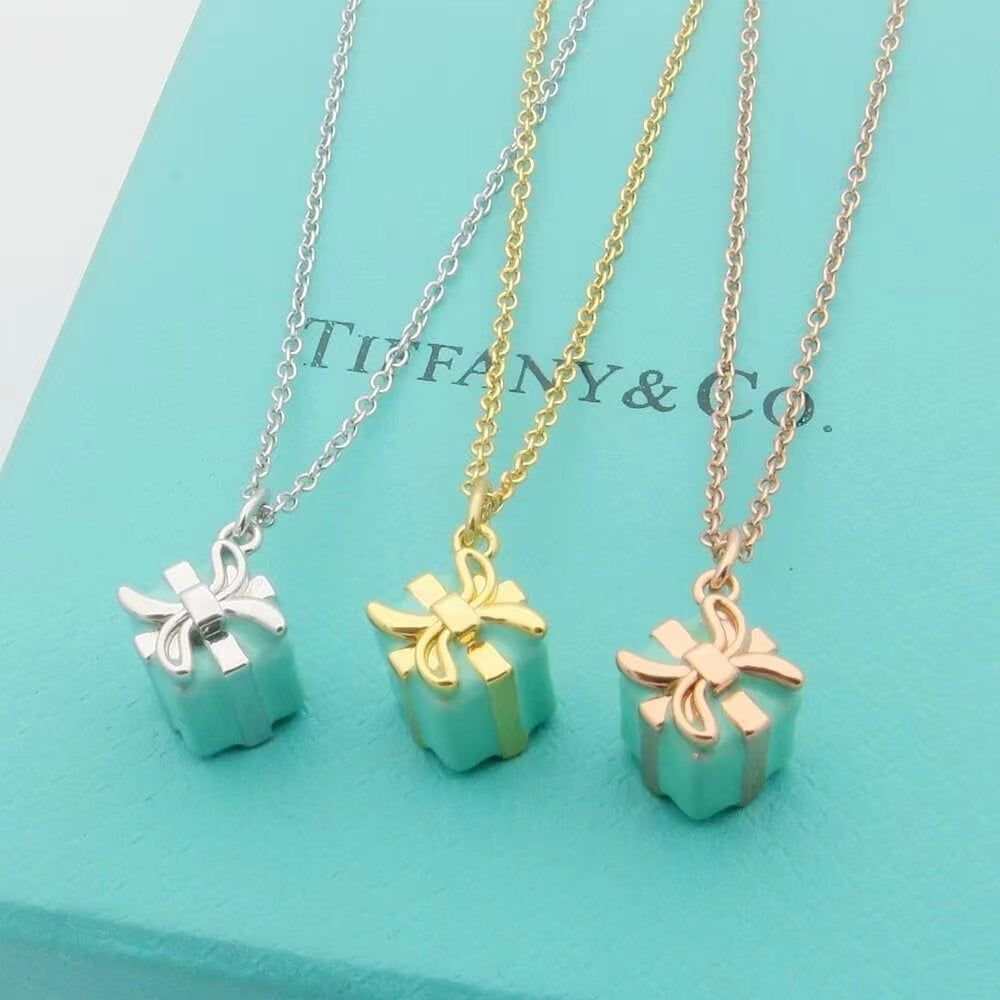 TIFFANY 26s GIFT BOX PENDANT NECKLACE IN BLUE ENAMEL AND GOLD PLATED METAL