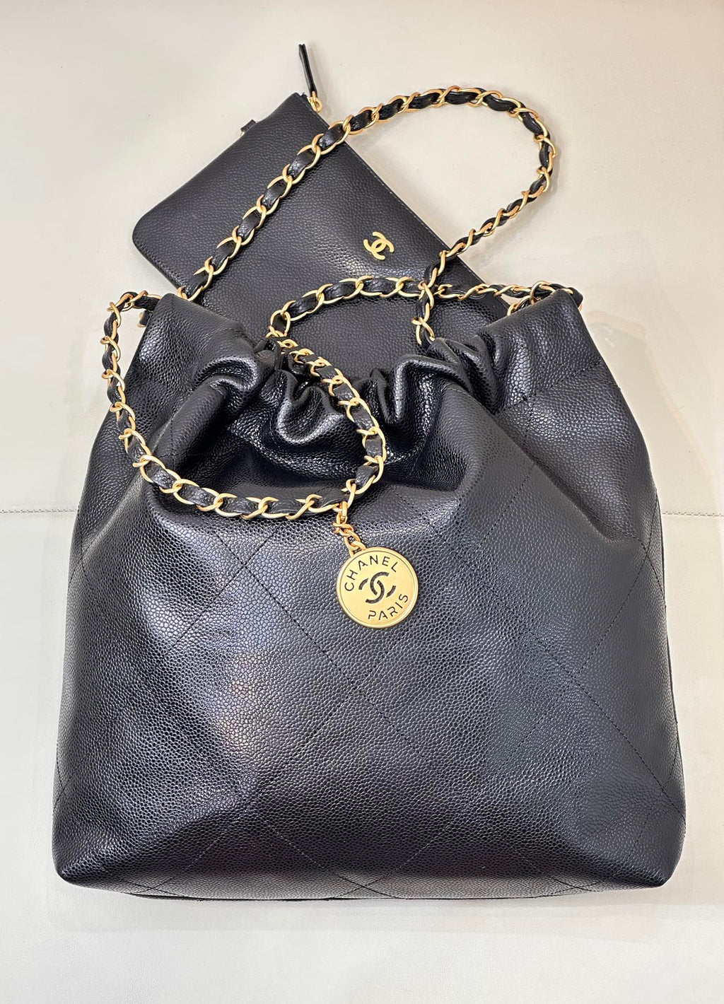 CHANEL 26S DRAWSTRING SHOULDER BAG 22 IN BLACK CAVIAR CALFSKIN