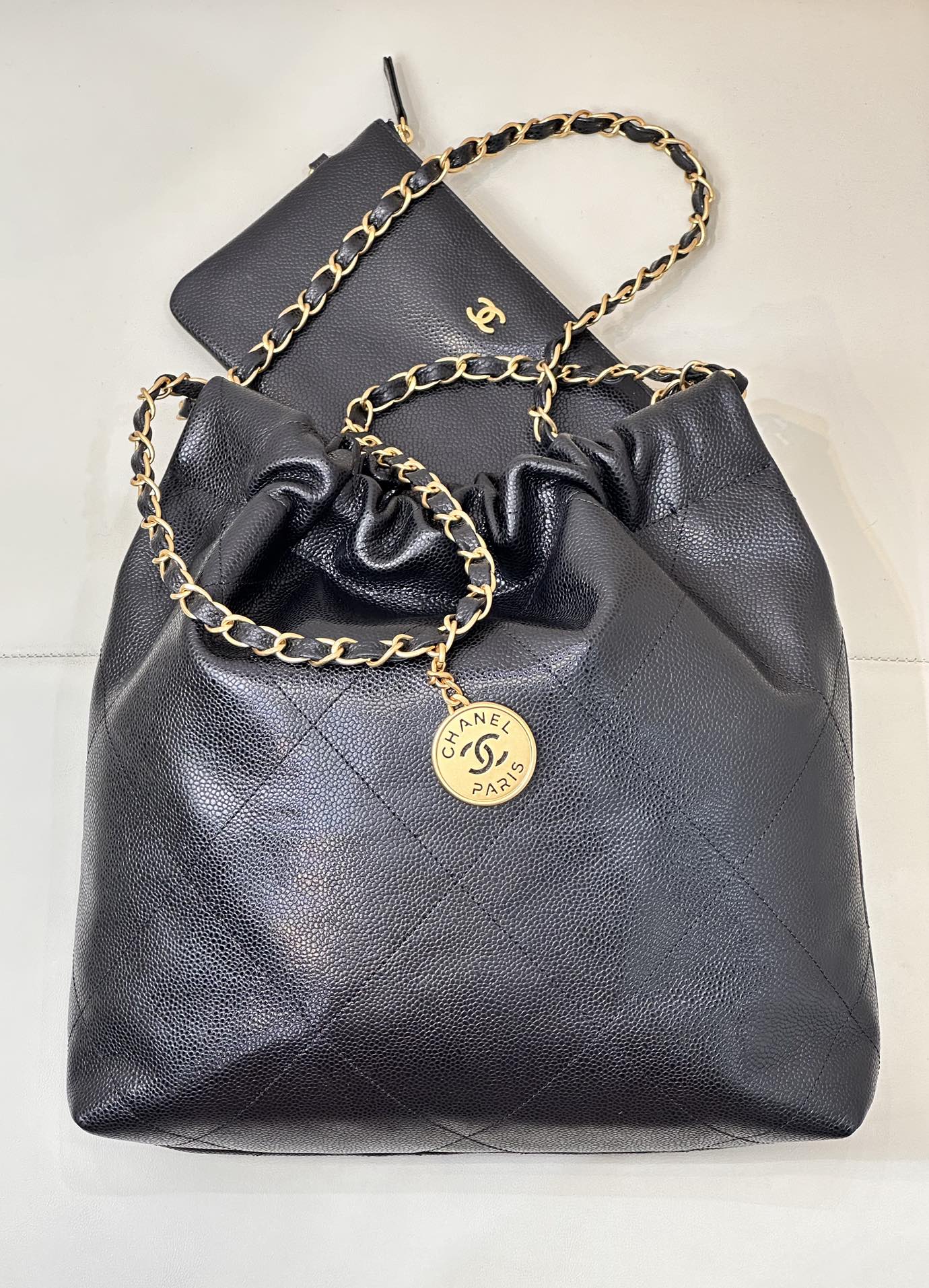 CHANEL 26S DRAWSTRING SHOULDER BAG 22 IN BLACK CAVIAR CALFSKIN