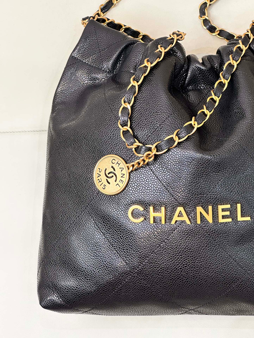 CHANEL 26S DRAWSTRING SHOULDER BAG 22 IN BLACK CAVIAR CALFSKIN