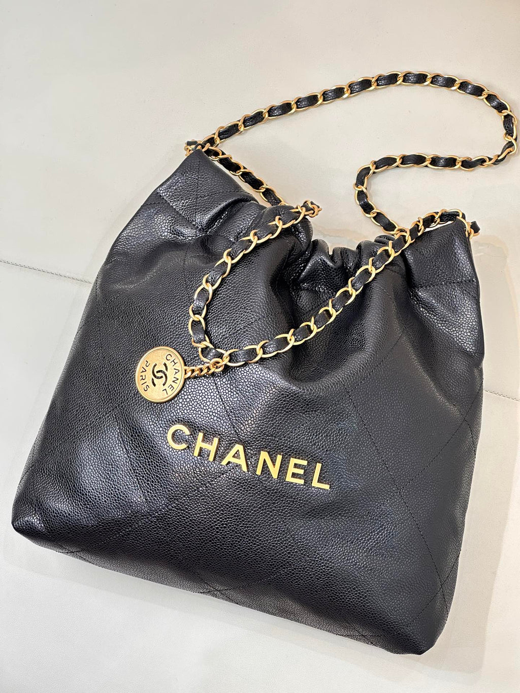 CHANEL 26S DRAWSTRING SHOULDER BAG 22 IN BLACK CAVIAR CALFSKIN