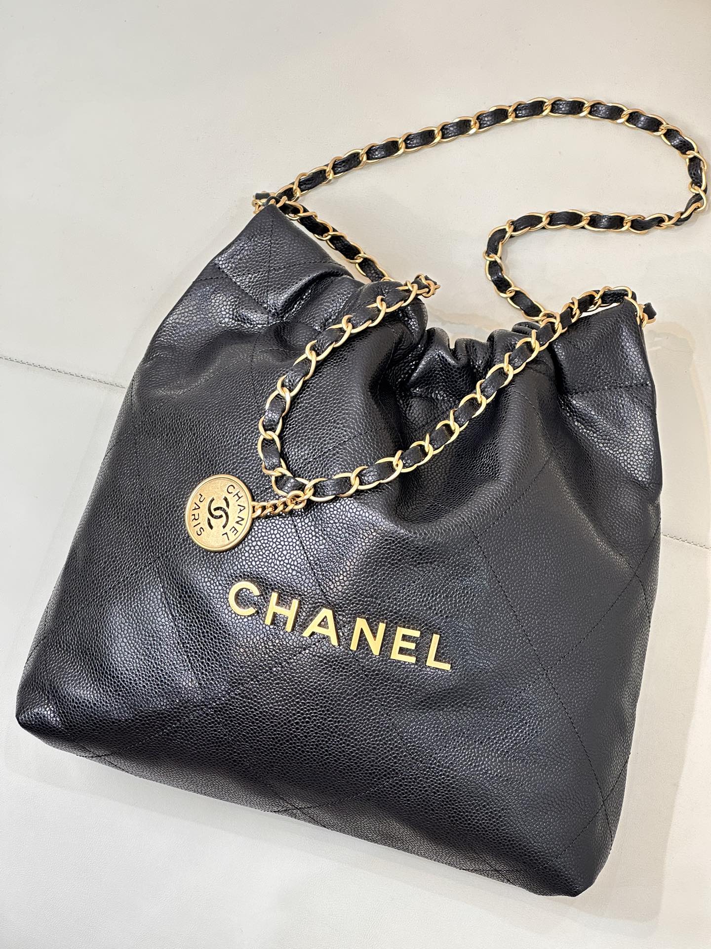 CHANEL 26S DRAWSTRING SHOULDER BAG 22 IN BLACK CAVIAR CALFSKIN