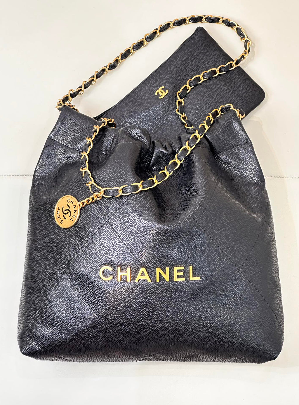 CHANEL 26S DRAWSTRING SHOULDER BAG 22 IN BLACK CAVIAR CALFSKIN