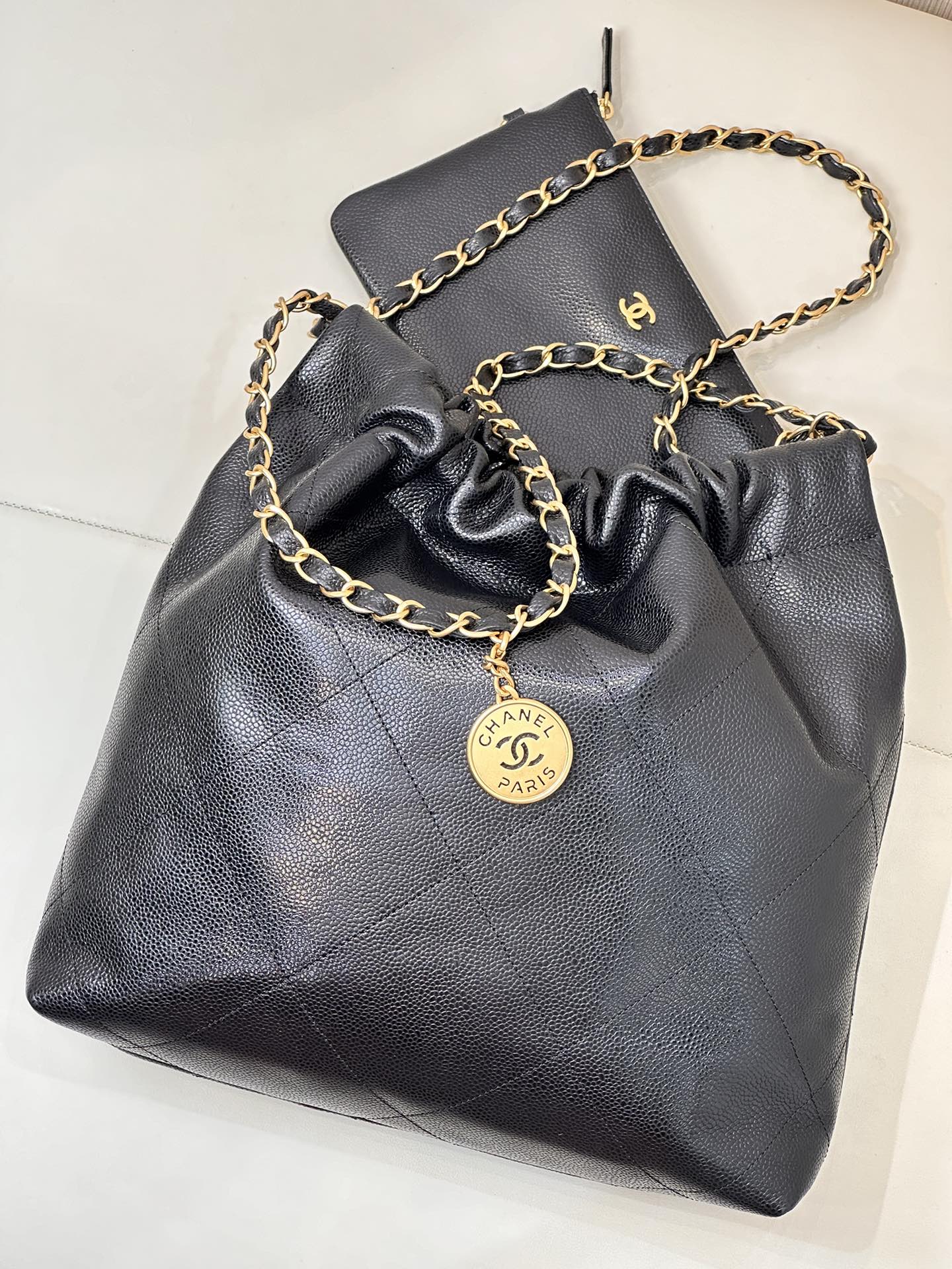 CHANEL 26S DRAWSTRING SHOULDER BAG 22 IN BLACK CAVIAR CALFSKIN