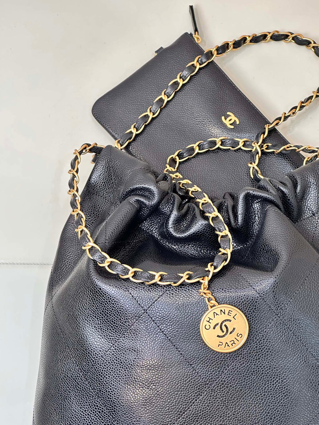 CHANEL 26S DRAWSTRING SHOULDER BAG 22 IN BLACK CAVIAR CALFSKIN