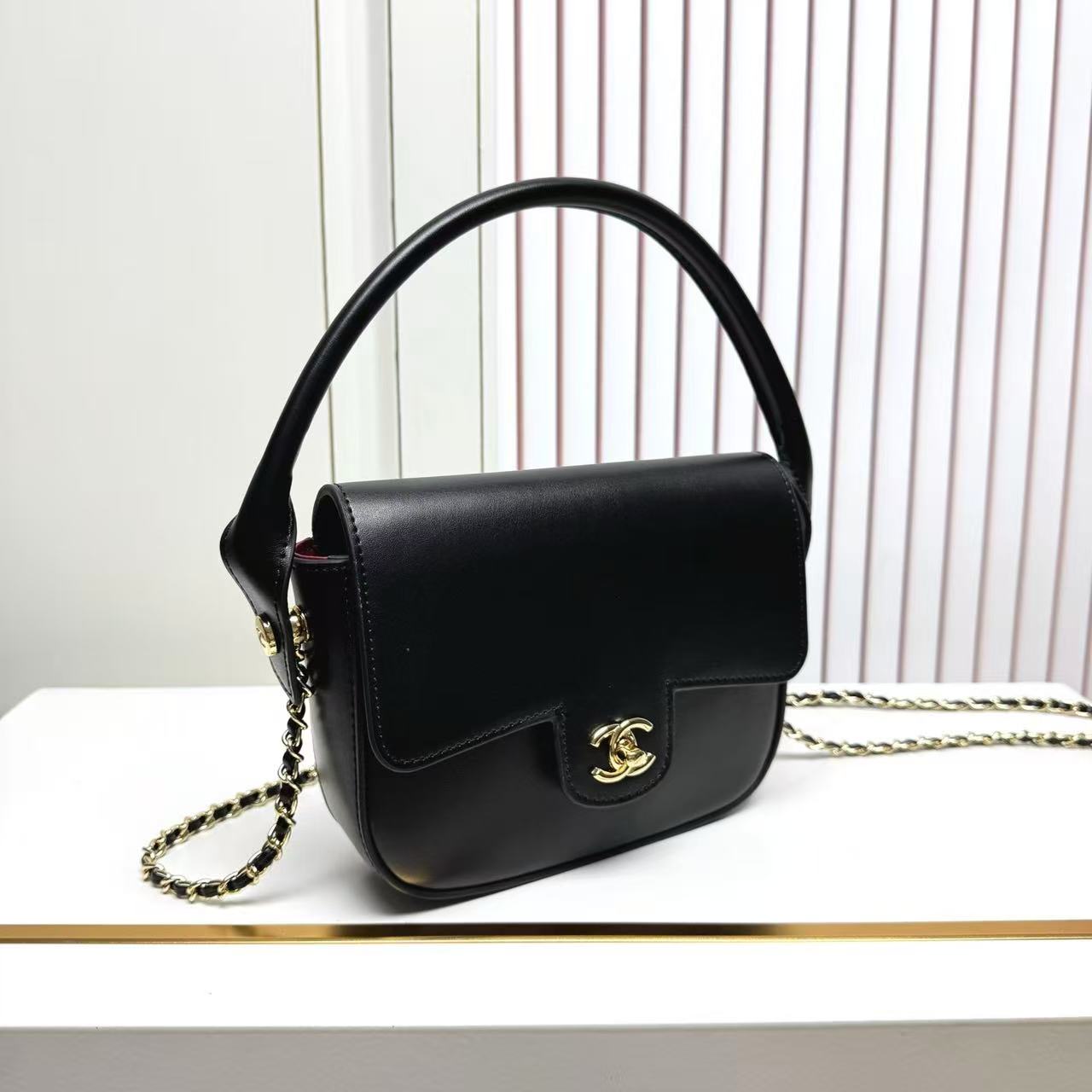 CHANEL 26S METIERS D'ART POCHETTE IN BLACK CALFSKIN GOLD HARDWARE