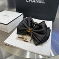 BLACK FABRIC AND RESIN CLAWCLIP GOLD-TONE LOGO