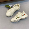 GG RHYTON LOGO-PRINT TRAINERS IN BEIGE CALFSKIN
