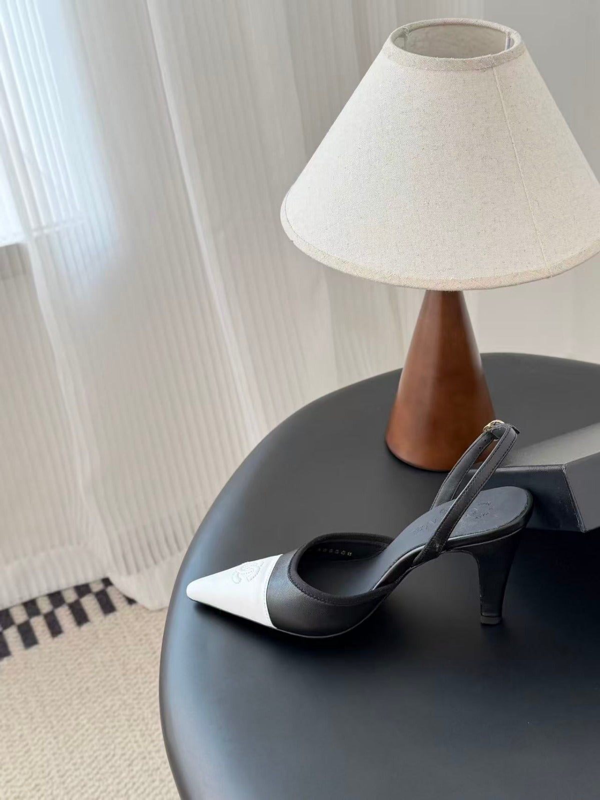 CHANEL POINTED TOE SLINGBACK PUMPS IN BLACK AND WHITE CALFSKIN