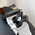 CHANEL POINTED TOE SLINGBACK PUMPS IN BLACK AND WHITE CALFSKIN