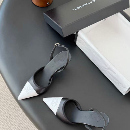 CHANEL POINTED TOE SLINGBACK PUMPS IN BLACK AND WHITE CALFSKIN
