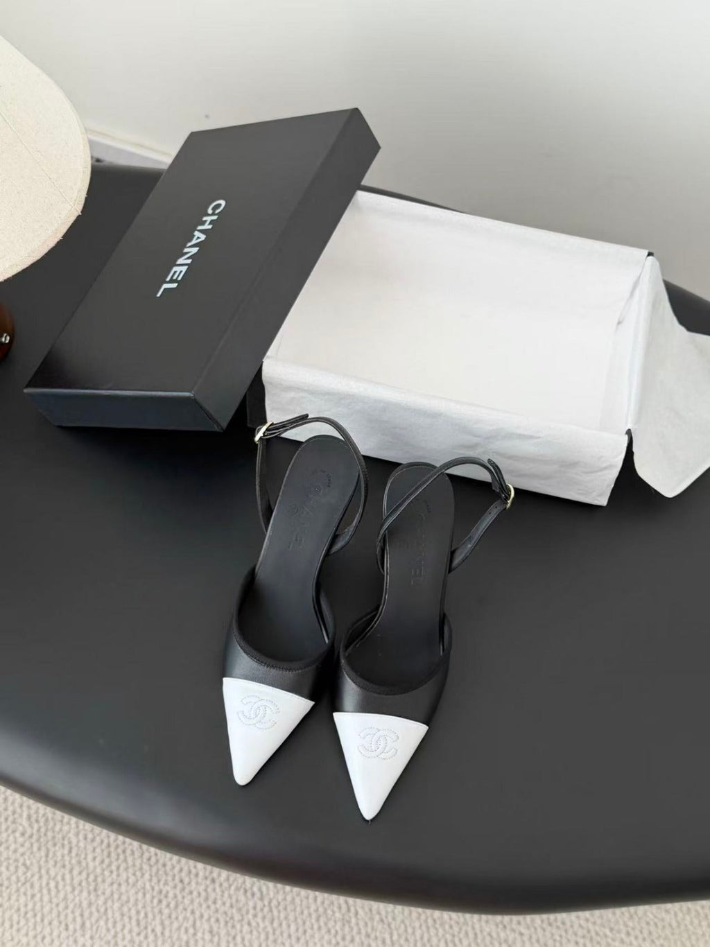 CHANEL POINTED TOE SLINGBACK PUMPS IN BLACK AND WHITE CALFSKIN