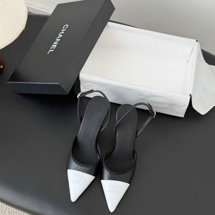 CHANEL POINTED TOE SLINGBACK PUMPS IN BLACK AND WHITE CALFSKIN