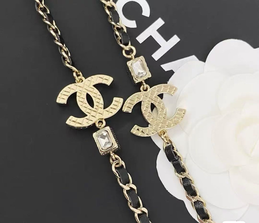 GOLD-TONE CHANEL CHAIN BELT WITH BLACK ENAMEL AND CRYSTAL-ENCRUSTED INTERLOCKING CC CHARMS