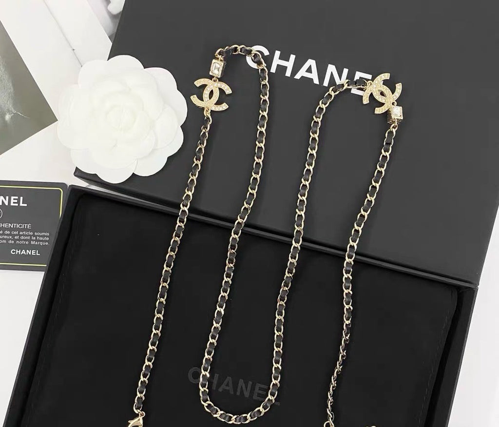 GOLD-TONE CHANEL CHAIN BELT WITH BLACK ENAMEL AND CRYSTAL-ENCRUSTED INTERLOCKING CC CHARMS