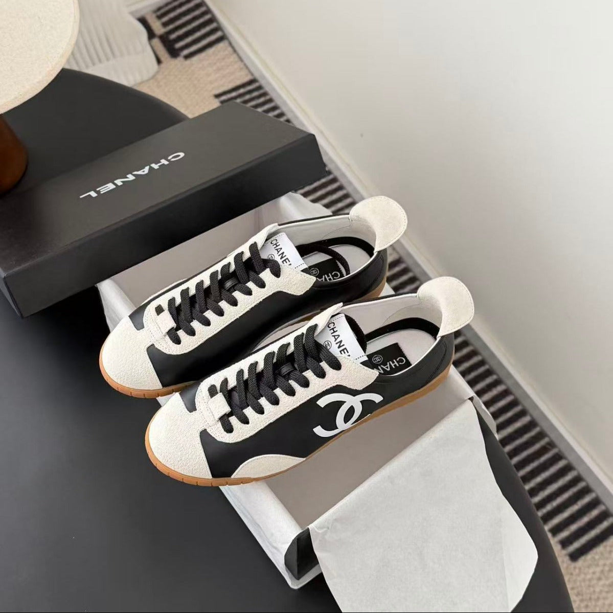 CHANEL TRAINERS IN BLACK AND WHITE CALFSKIN AND EMBOSSED SUEDE CALFSKIN