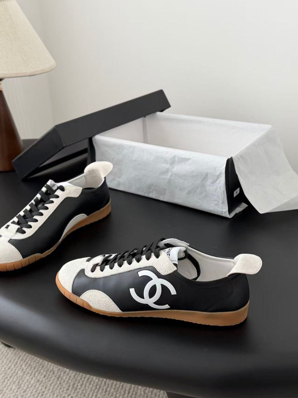 CHANEL TRAINERS IN BLACK AND WHITE CALFSKIN AND EMBOSSED SUEDE CALFSKIN