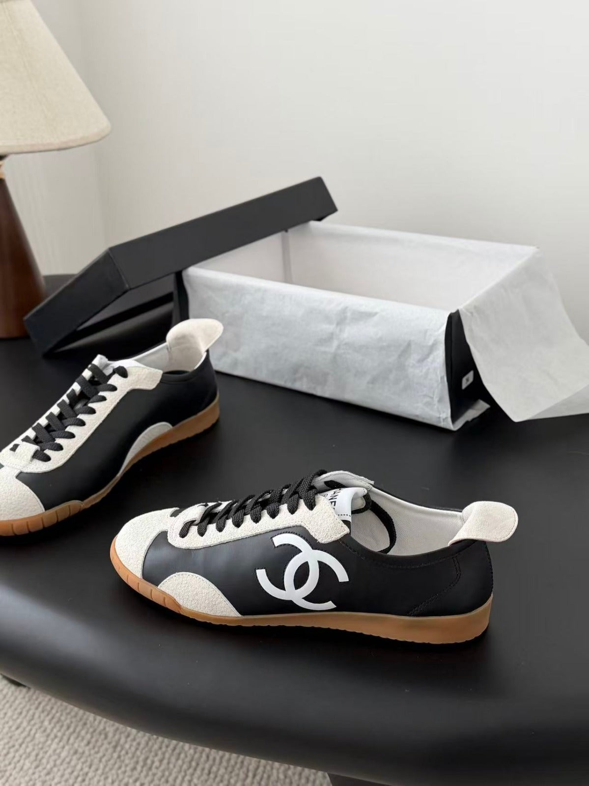 CHANEL TRAINERS IN BLACK AND WHITE CALFSKIN AND EMBOSSED SUEDE CALFSKIN
