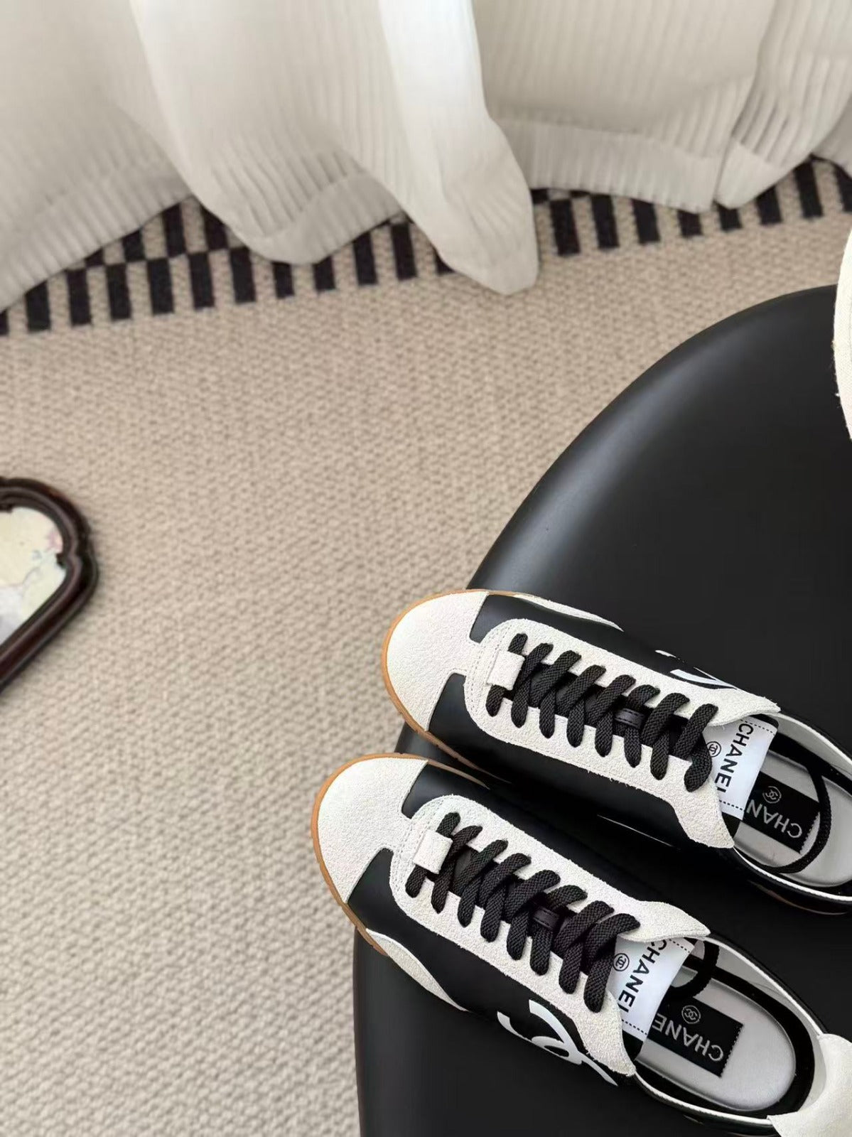 CHANEL TRAINERS IN BLACK AND WHITE CALFSKIN AND EMBOSSED SUEDE CALFSKIN