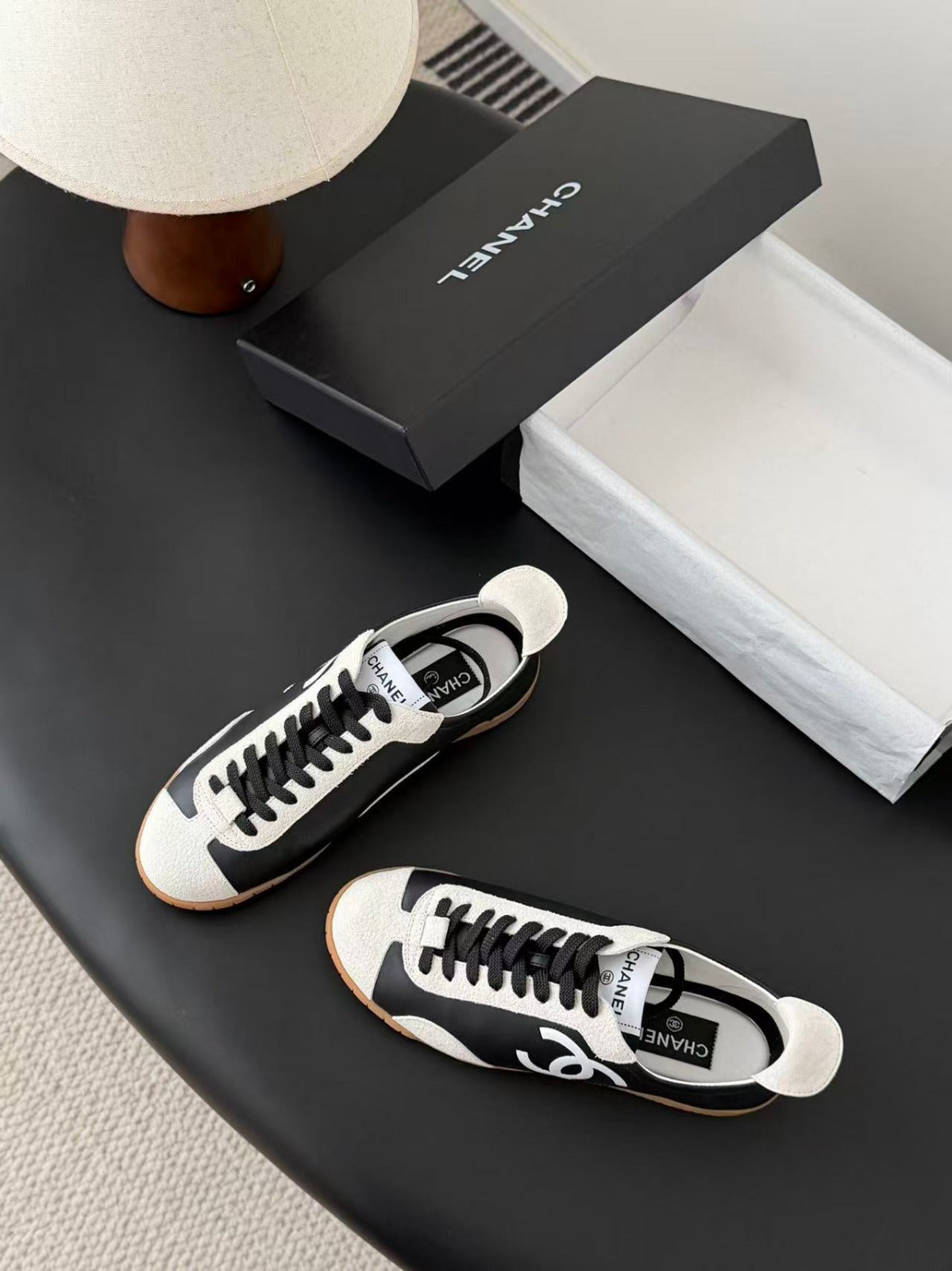 CHANEL TRAINERS IN BLACK AND WHITE CALFSKIN AND EMBOSSED SUEDE CALFSKIN
