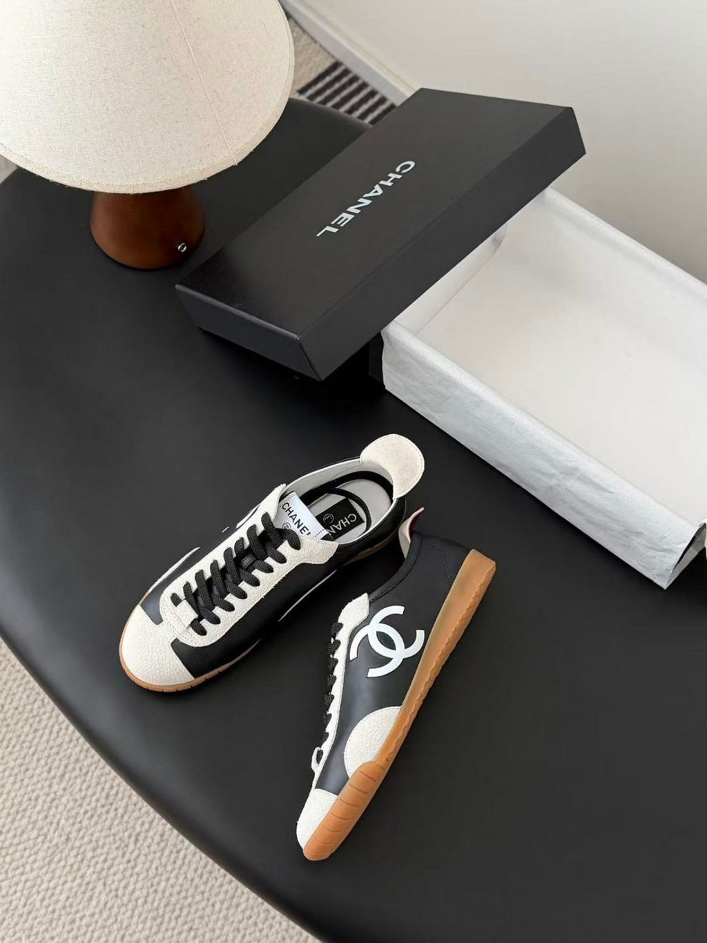 CHANEL TRAINERS IN BLACK AND WHITE CALFSKIN AND EMBOSSED SUEDE CALFSKIN