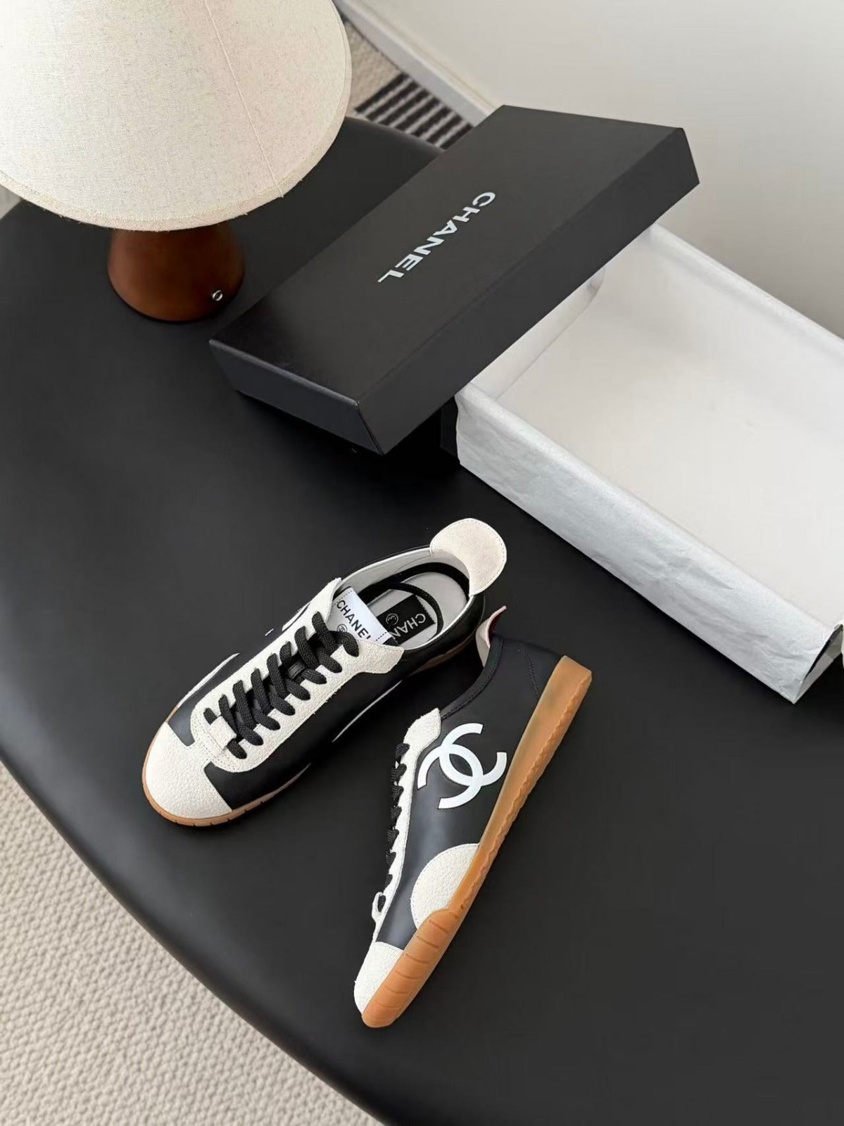 CHANEL TRAINERS IN BLACK AND WHITE CALFSKIN AND EMBOSSED SUEDE CALFSKIN