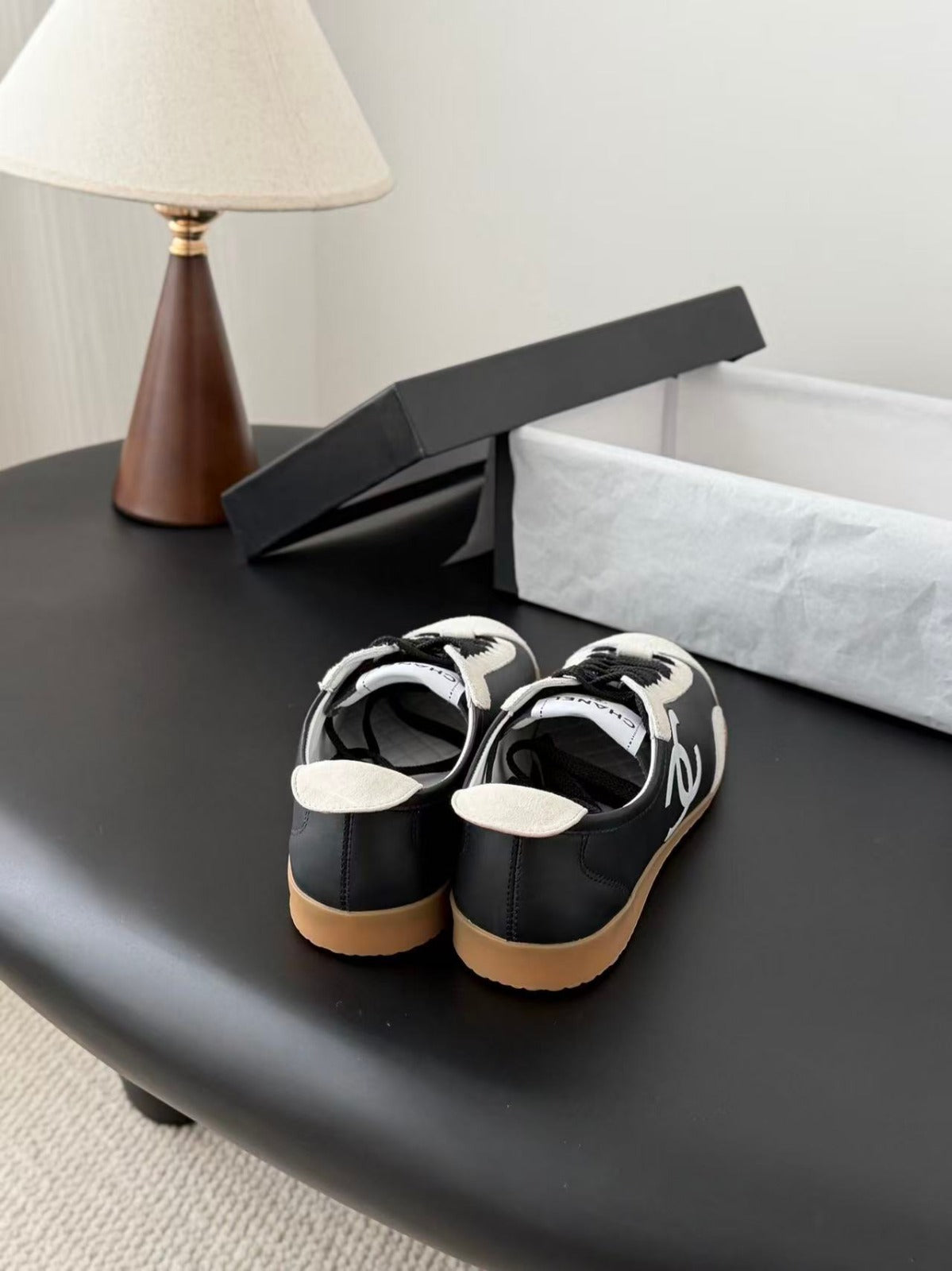 CHANEL TRAINERS IN BLACK AND WHITE CALFSKIN AND EMBOSSED SUEDE CALFSKIN