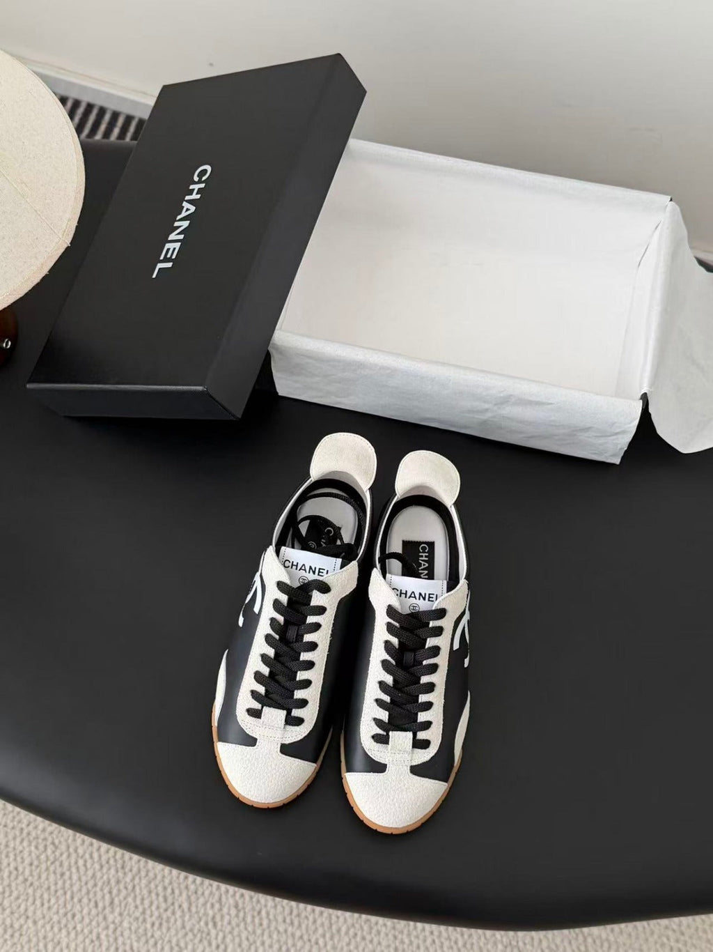 CHANEL TRAINERS IN BLACK AND WHITE CALFSKIN AND EMBOSSED SUEDE CALFSKIN