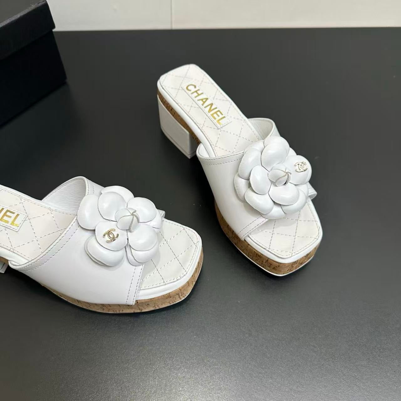 CHANEL CAMELLIA SLIDE SANDALS IN WHITE CALFSKIN