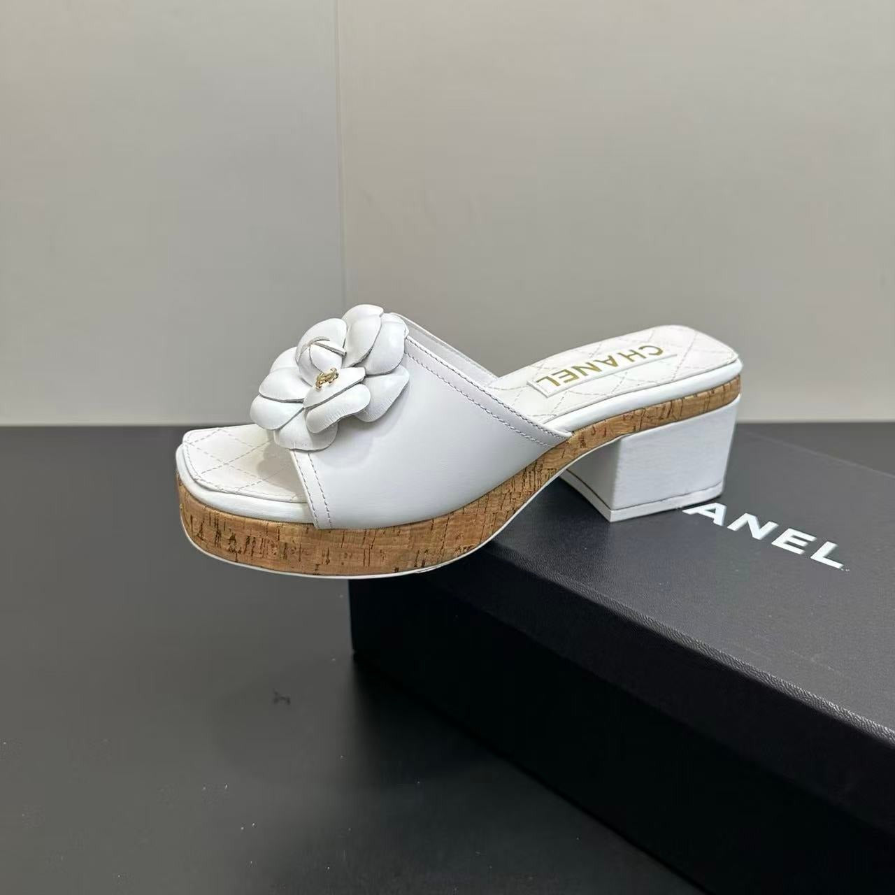 CHANEL CAMELLIA SLIDE SANDALS IN WHITE CALFSKIN