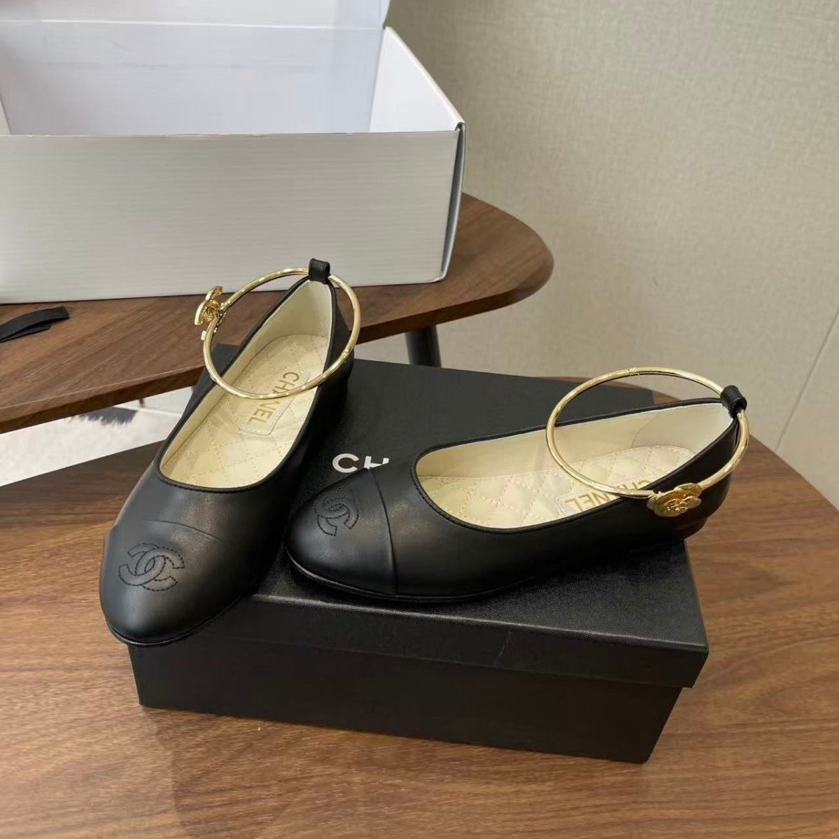 CHANEL GOLD ANKLE STRAP BALLET FLATS IN BLACK CALFSKIN