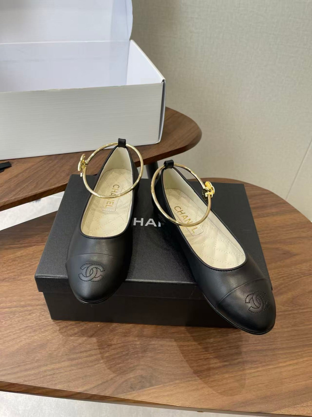 CHANEL GOLD ANKLE STRAP BALLET FLATS IN BLACK CALFSKIN
